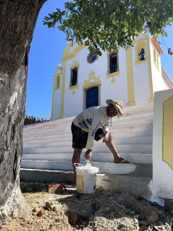 Whitwashing the church steps